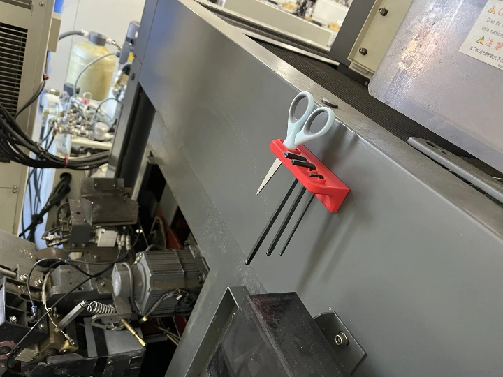 Tool holder on the back of a wire EDM machine